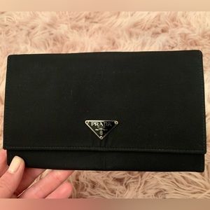 Authentic Prada wallet. Used but in good condition.